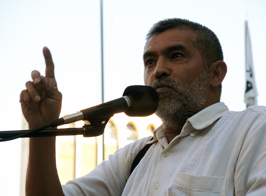 A spokesperson for the •Federación Nacional Campesina FNC speaks at the rally. PhotoLangelle