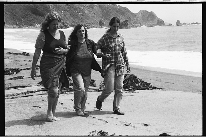 Judi Bari, center, walks on a Pacific Ocean beach in California with the support of two women friends  after a pipe-bomb ripped through her car in 1990 - See more at: https://photolangelle.org/blog-2/#sthash.H5VB3OGI.dpuf