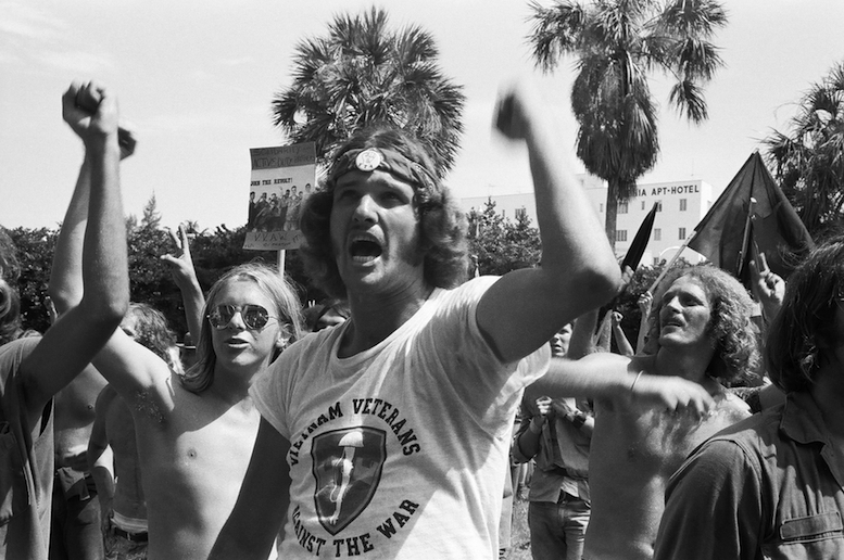 During the 1972 Republican National Convention in Miami Beach, FL, members of Vietnam Veterans Against the War (VVAW) show their outrage as they protest the lives lost (both US and Vietnamese) in the Vietnam War. Both VVAW members and thousands of anti-war demonstrators massed at the convention to show their opposition to the war. PhotoL: Langelle